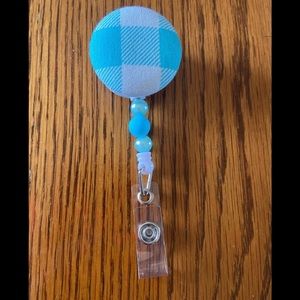 Blue and Blue Pearl Beaded Interchangeable Badge Reel with 1 topper as shown.